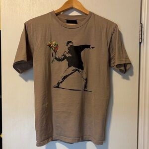 Banksy’s flower thrower Graphic Tee